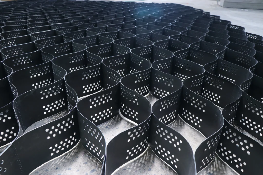 ATWEB geocell system deployed over soft soil, filled with infill material for road construction